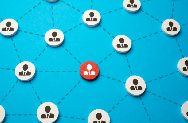 istock Red highlighted person in the network. Working relationships and involvement in work. Participation in a common project. Communication and cooperation. 1828281660