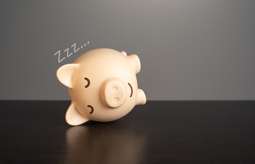 Sleeping pig piggy bank. Security of savings and passive income on deposits. Financial stability and growth of funds. Fostering a sense of security and tranquility.