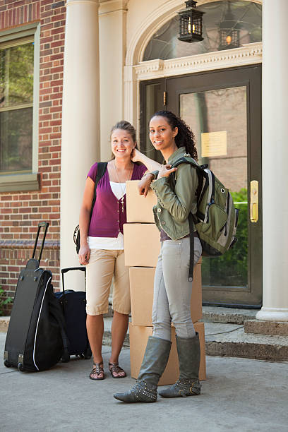 istock University Students Moving Boxes Outside of Dorm on Campus Vt 182828313