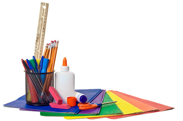 School Supplies "An assortment of school supplies. Pencils, pens, a ruler, white glue and a glue stick, scissors, erasers, and an assortment of report covers." yellow scissors stock pictures, royalty-free photos & images