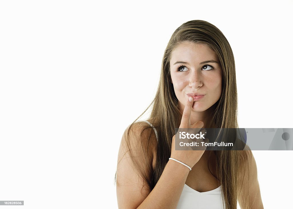 Beautiful Young Woman Thinking "A cute teenage girl looks up perhaps thinking over a decision, contemplating a problem, remembering good times, planning for the future, etc. against white background with copy space." 16-17 Years Stock Photo