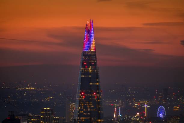 The festive illuminated top of the famous Shard building London, England - December 1st 2023: the festive illuminated top of the famous Shard building at London Bridge the shard close up stock pictures, royalty-free photos & images