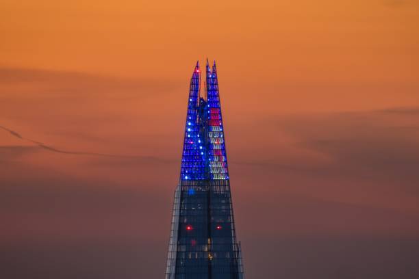 The festive illuminated top of the famous Shard building London, England - December 1st 2023: closeup view of the festive illuminated top of the famous Shard building at London Bridge the shard close up stock pictures, royalty-free photos & images