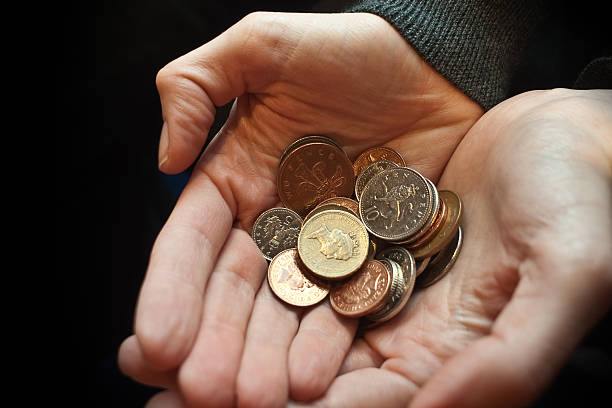 istock Handfull of Coins 182830405