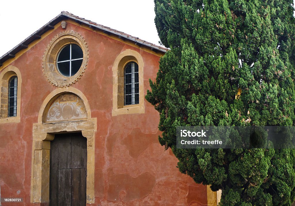 Old country church An old coutry church with cypress in Tuscany Rural Scene Stock Photo