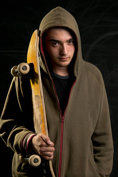 istock rebellious young male skateboarder 182831204