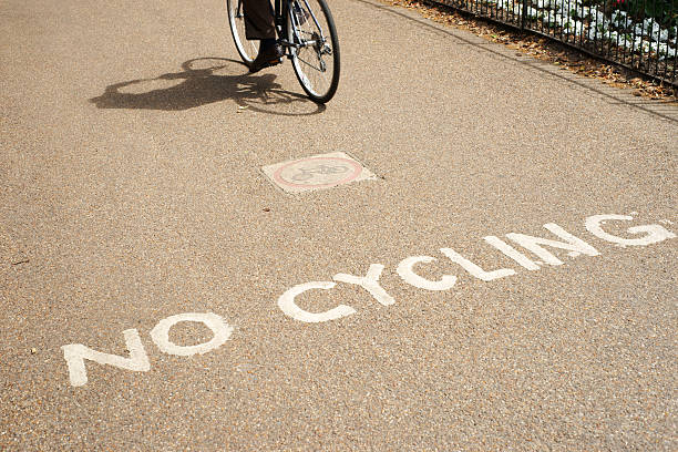 istock Cyclists ignoring no cycling sign 182831210