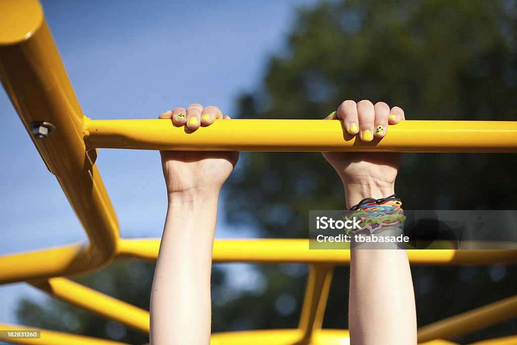 silly rubber band bracelets An eight year old child wearing silly rubber band bracelets at the playground. Bracelet Stock Photo