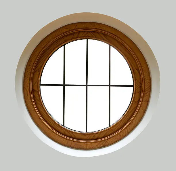 A porthole style window from an expensive new home. The mahogany framed leaded glass window has been recessed into a wall. The surrounding finish has been processed to be an even tone to enable easy expansion of canvas size. Each window pane has been blanked out and a single clipping path is present for all the panes to enable easy placement of a background view of your choice. Looking for a window Please see my window collection including cut-outs with clipping paths by clicking on the Lightbox Link below...