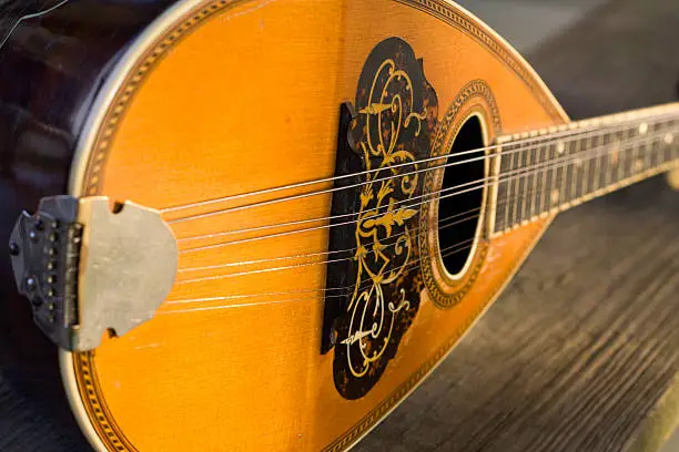 Closeup shot of an antique mandolin (string instrument), shot with a shallow depth of field