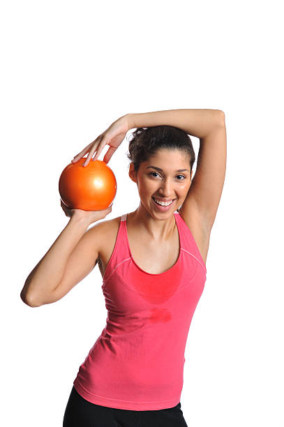 istock Young Hispanic woman with exercise ball 182831543