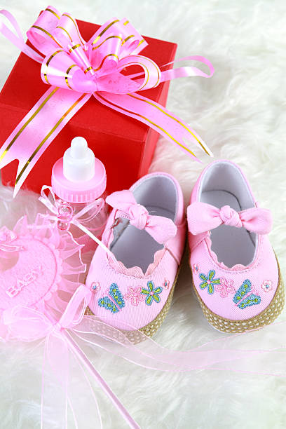 istock Pink baby shoes red gift box 182831921