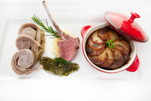 lamb cooked in three differant styles being grilled chop cassarole and slow cooked breast