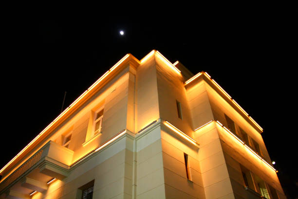 istock office building at night with the moon 1828320489