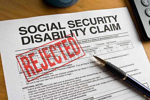 istock A social security disability claim form stamped REJECTED 182832340