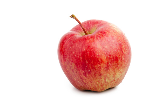 Bright red apple over white background