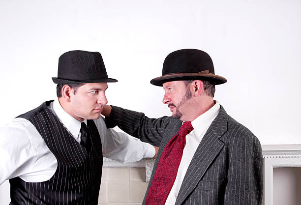Two Men Wearing Hats In Serious Discussion