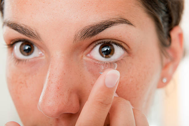 istock Inserting a Contact Lens in the Eye (XXXL) 182833608