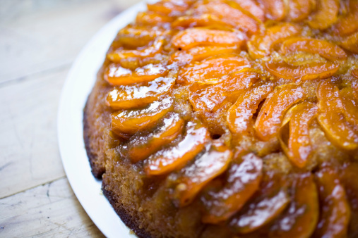 Close up of apricot upside-down cake showing the texture of the fruit and the cake