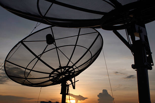 istock Modern satellite dish at dusk against blue sky 182835154