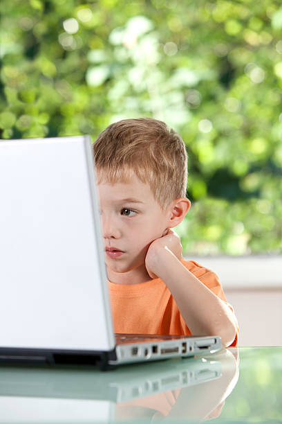 istock Little boy and the laptop 182836078