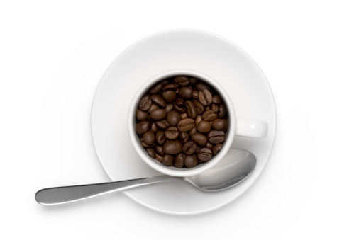 Aerial view of a cup of coffee beans isolated on white with Clipping Path and shadow