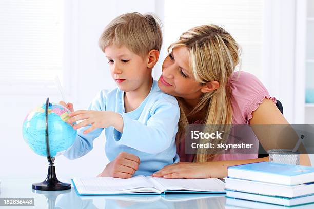 Mother And Son Globe Used In Learning Stock Photo - Download Image Now - Adult, Beautiful People, Beauty