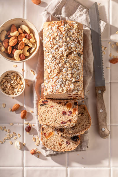 istock Delicious delicacies bread with bran, raisins and nuts. 1828365302