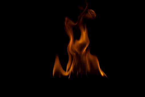 The fire flames is powerful , Shoot in a studio with a black background.