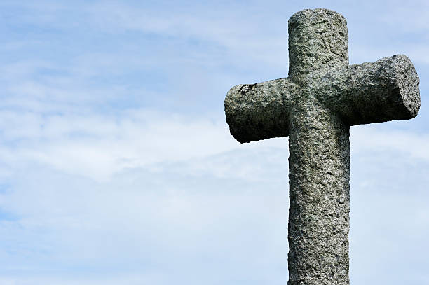 istock Old carved stone cross in a Scottish cemetery 182837376