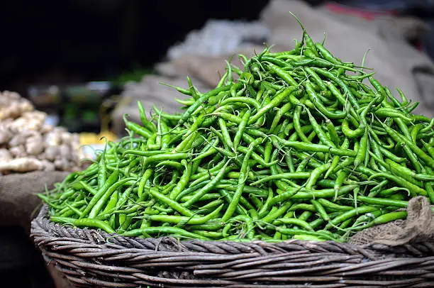 "Green chilli peppers for sale at the souq or market. These shot in Pune, India.Please see some more Souq/street market images from my portfolio:"
