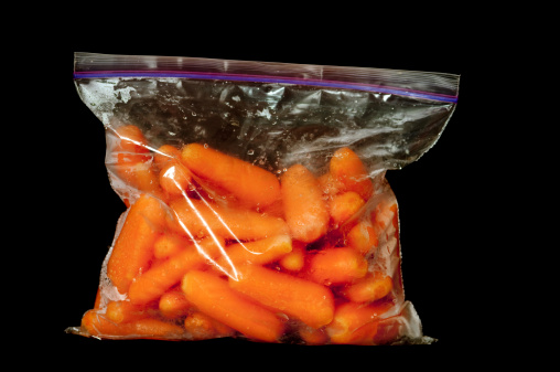 A freezer bag (ziplock bag) full of baby carrots.