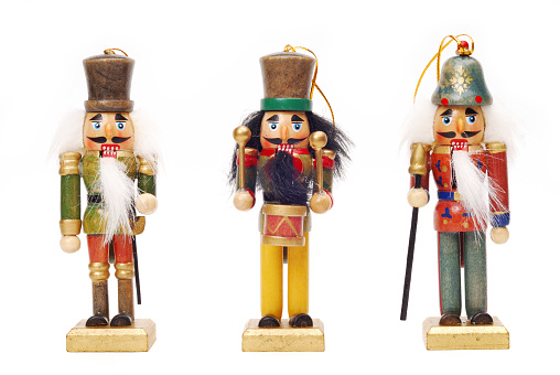 three nutcrackers on white background