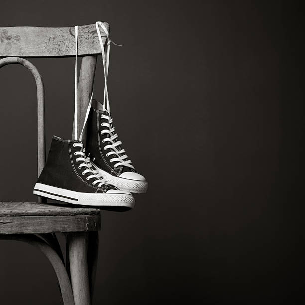 istock Sneakers hanging on chair 182838023