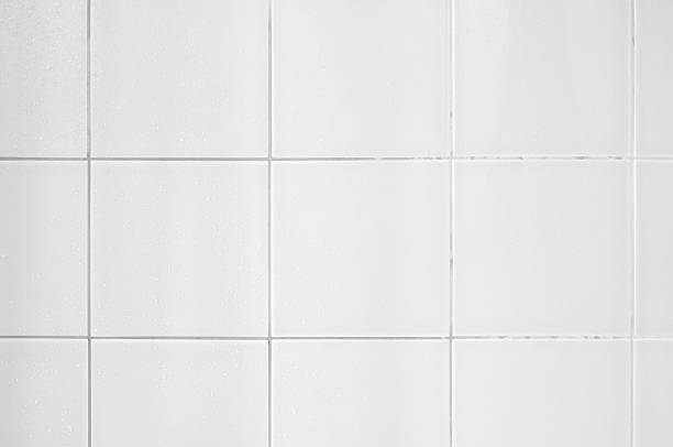 istock Photo of a wall covered by white tiles 182838272