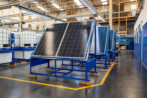 Solar panels at a factory Solar panels at a factory - manufacturing concepts solar panel manufacturing stock pictures, royalty-free photos & images