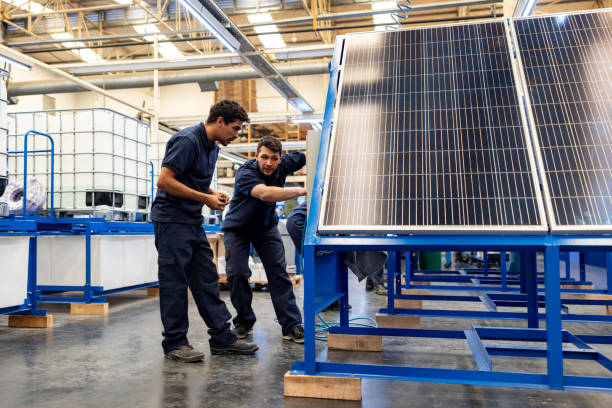 istock Engineers installing solar panels at a factory 1828384785