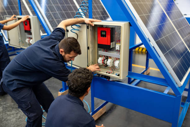 istock Engineers installing solar panels at a factory 1828385257