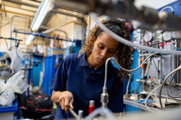 istock Woman working at a manufacturing factory 1828385928