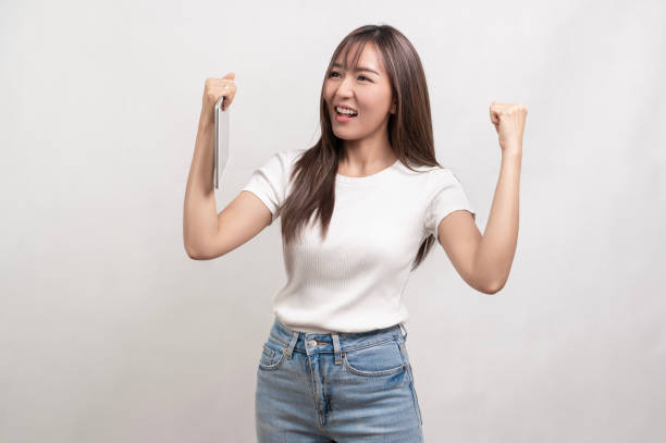 istock Young asian woman using tablet over white background, technology concept 1828386492