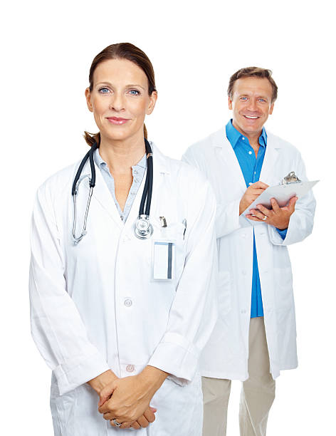 istock Portrait of smiling doctors standing against white background 182838671