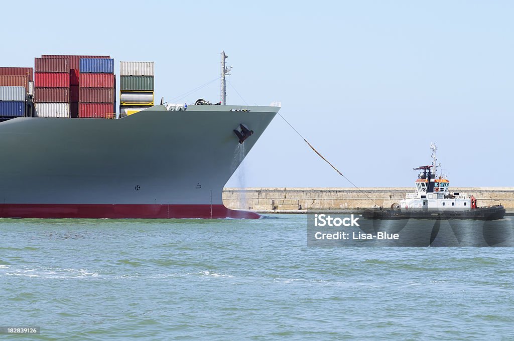 Container Ship and Tugboat Container ship and tugboat Accidents and Disasters Stock Photo