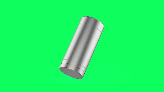 Alkaline battery spinning isolated on green 4k footage