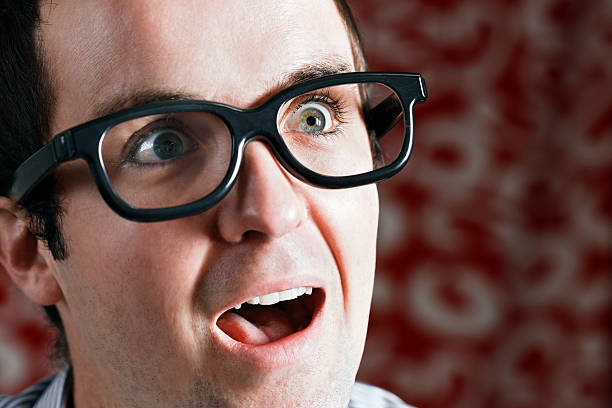 istock Nerdy young man looks amazed 182839509