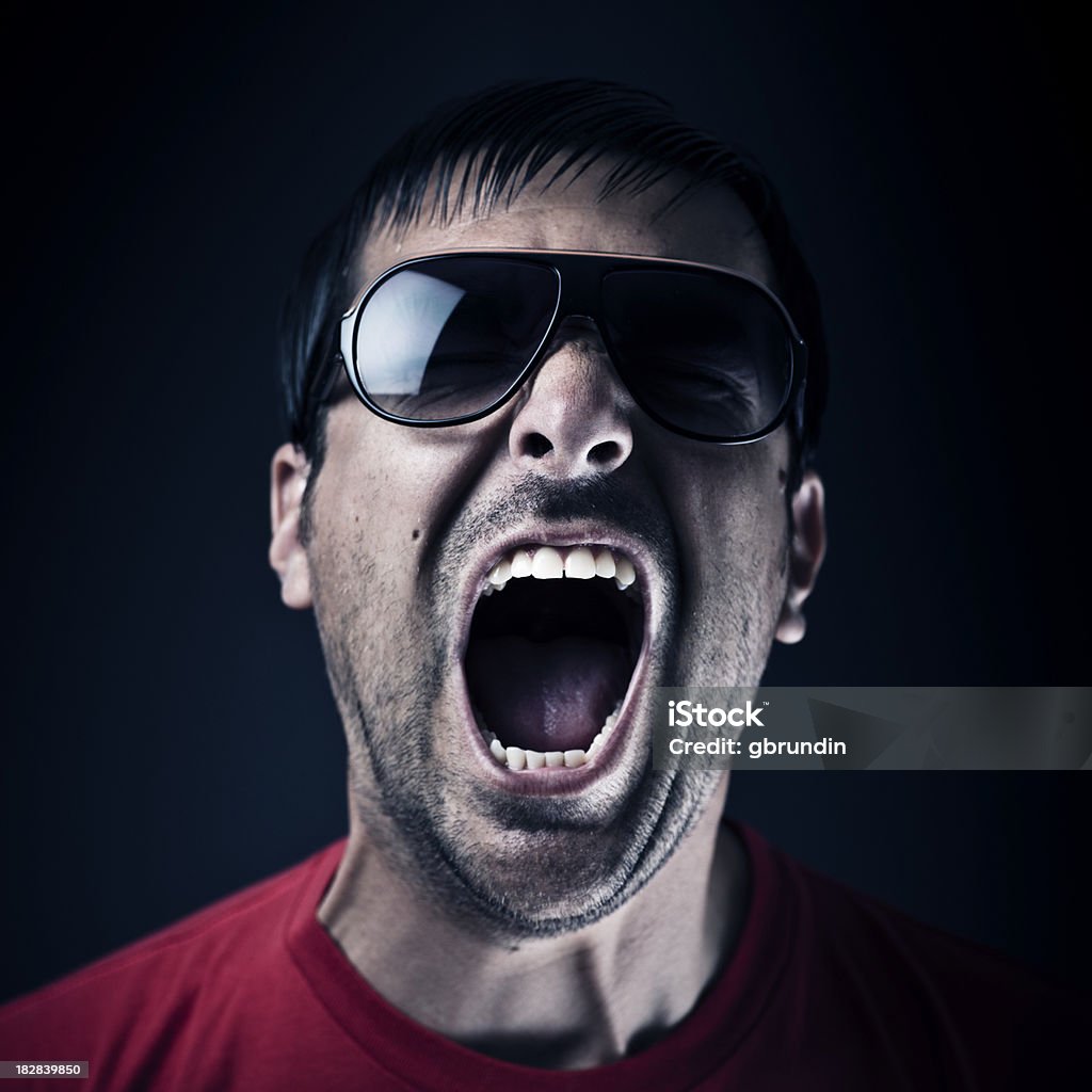 Dark man screaming "Dark man screaming, dark/black background." Adult Stock Photo