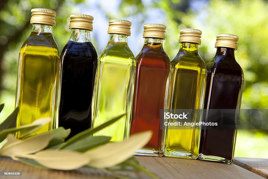 Different oils and vinegars Salad dressings Vinegar Stock Photo