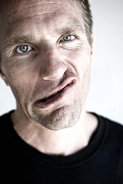 istock Man Makes Funny Face in Close-Up Portrait 182840457