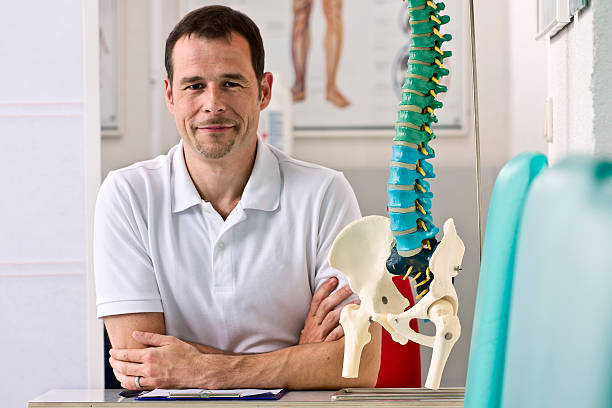 Physical Therapist Sitting at his Desk stock photo