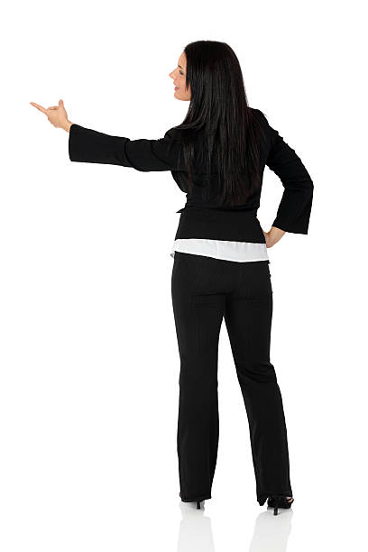 istock Businesswoman pointing against white background 182840955