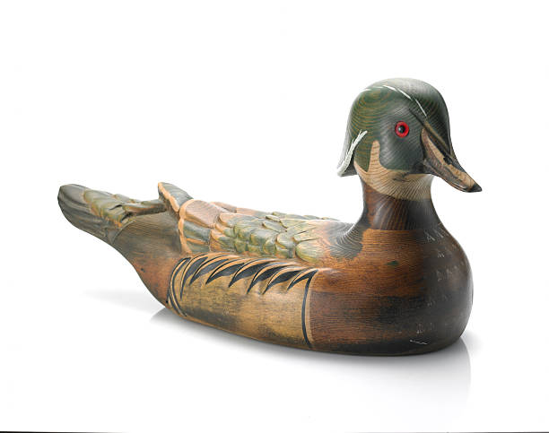Wooden Decoy Wood duck decoy on white. hunting decoy photos stock pictures, royalty-free photos & images
